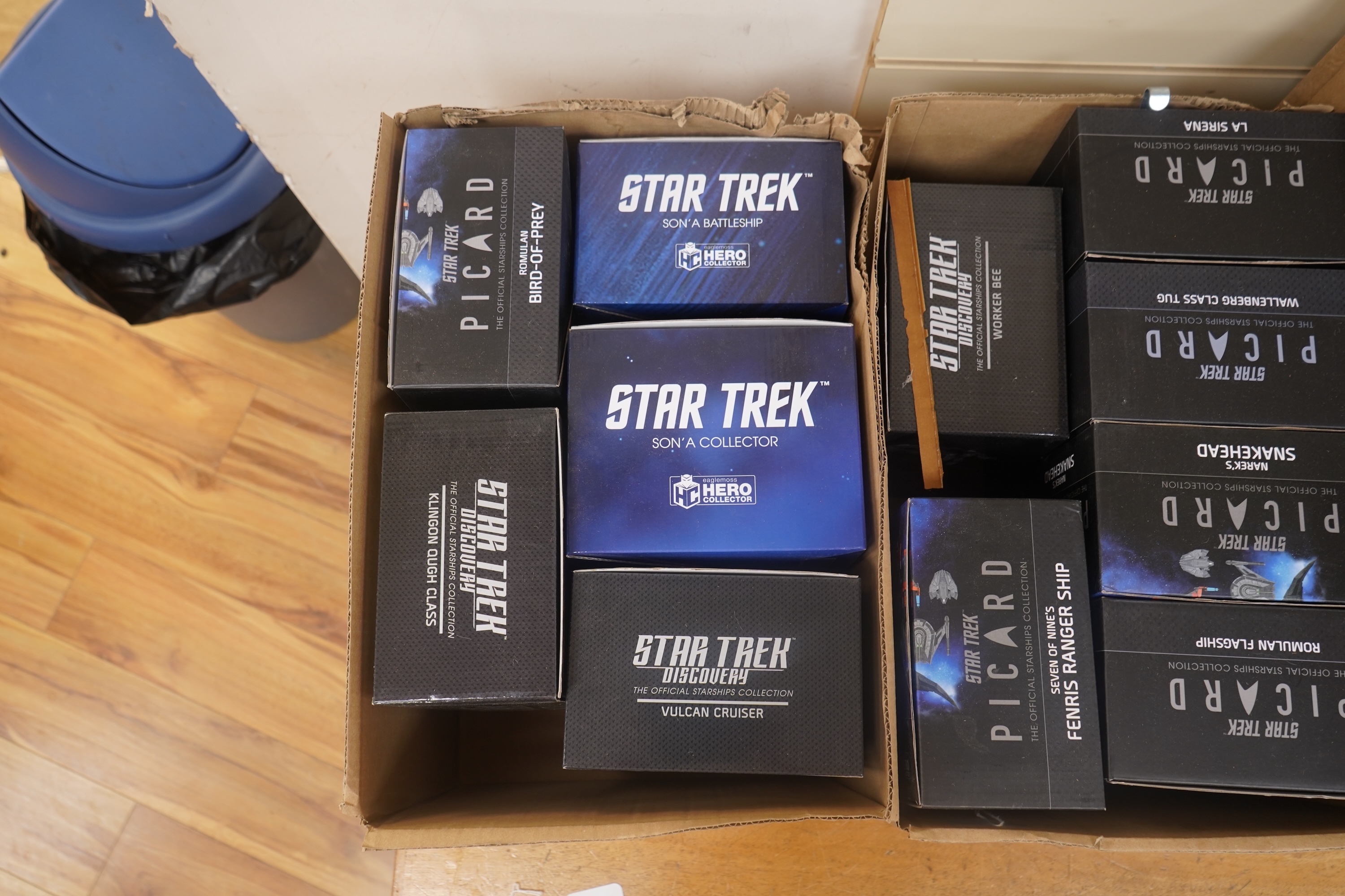 Eighteen boxed Eaglemoss Star Trek magazine issue models, including; a Vulcan Cruiser, a Klingon Qugh Class vessel, a Son’a Battleship, a Romulan Flagship, Jupiter Station, Ty’Gokor Orbital Station, etc. Condition - good